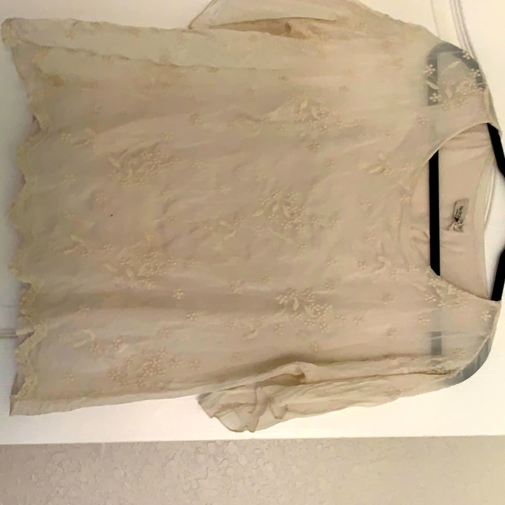 Cream colored blouse with enhance embroidery